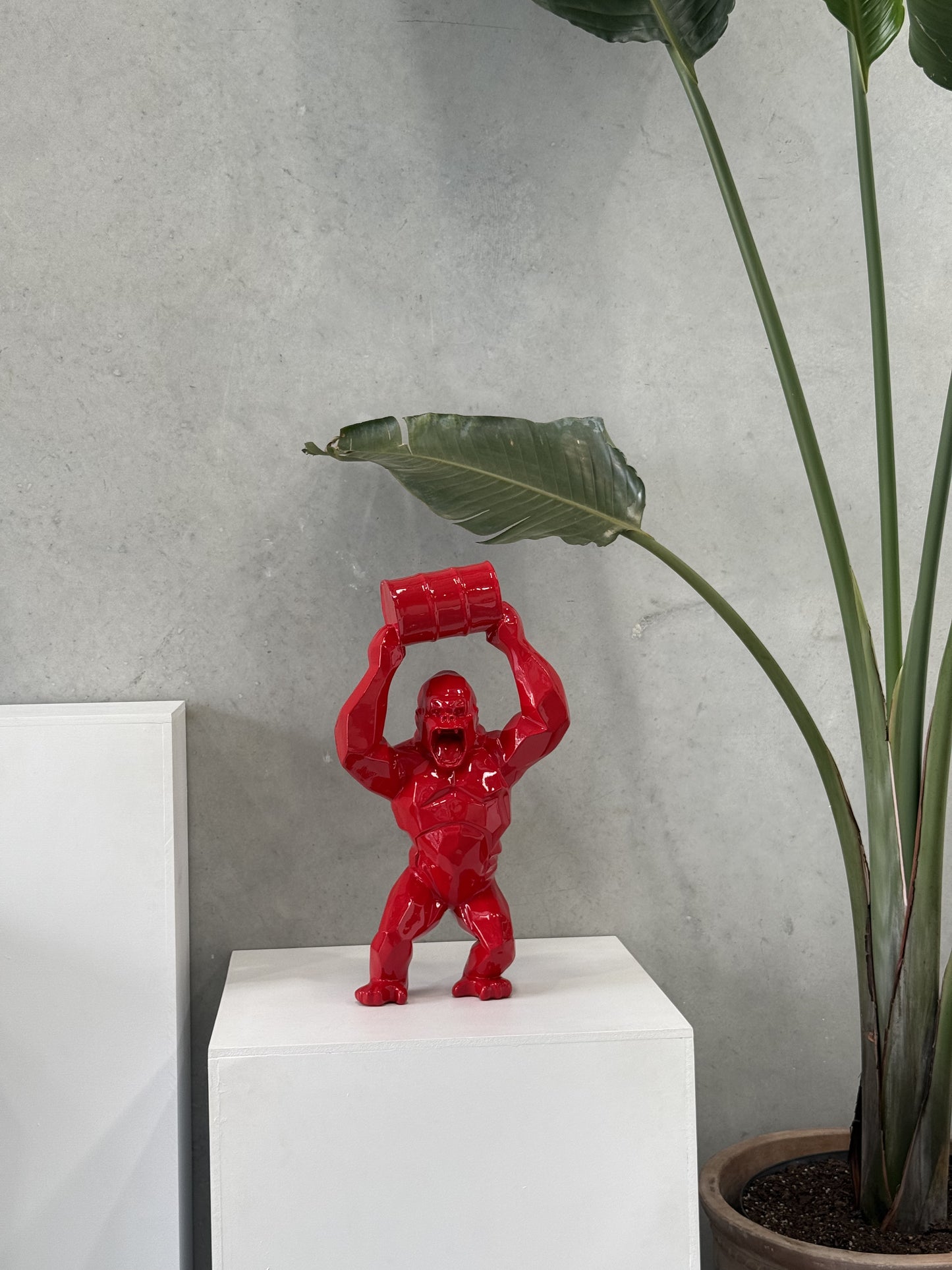 Red Gorilla Statue with Barrel